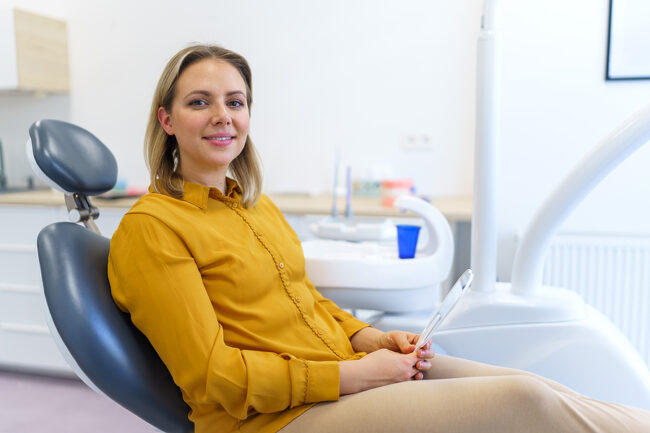 Portrait Of Young Woman In Dentist Chair.