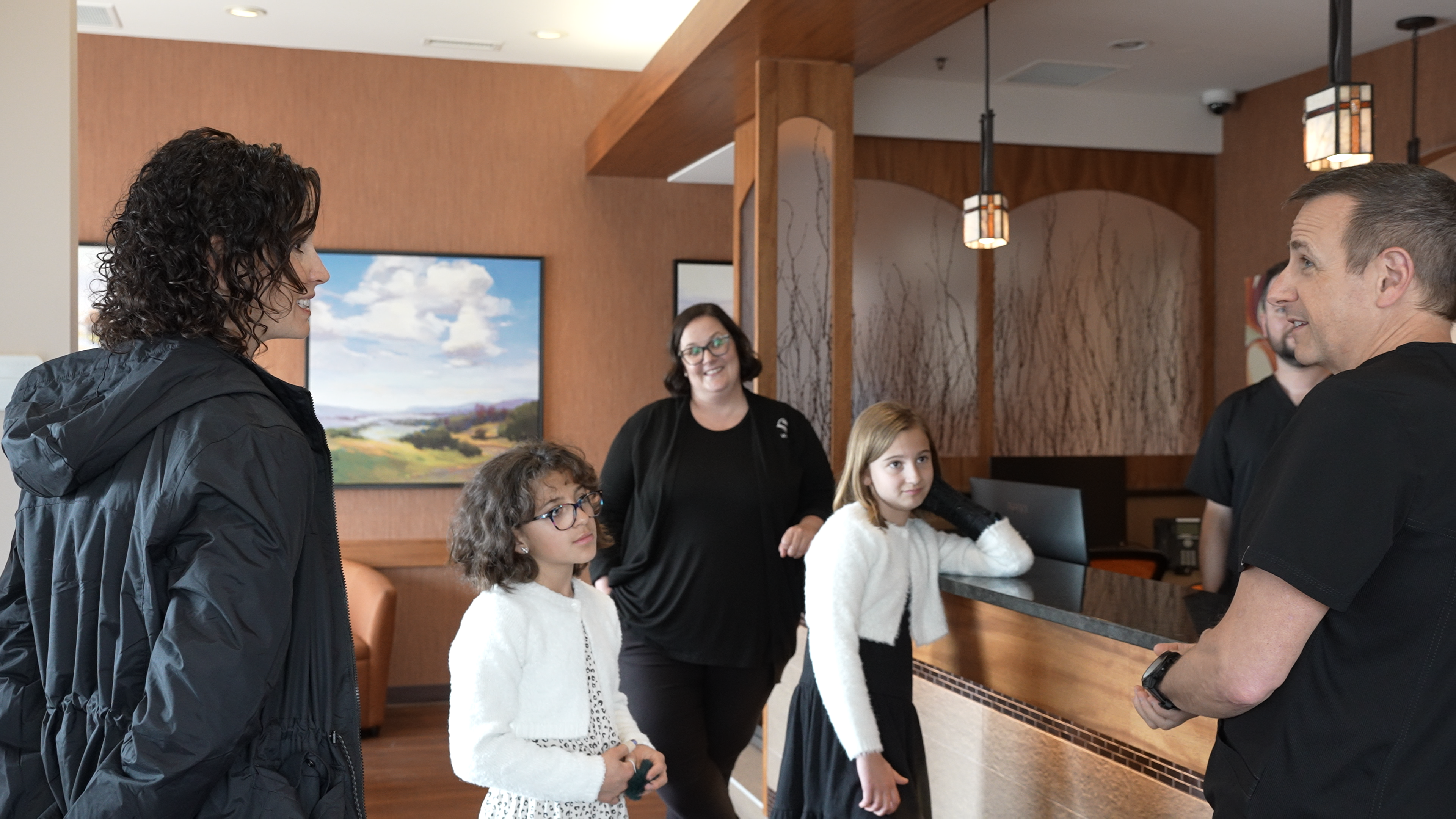 Patients inside a family dental clinic in Calgary, AB.